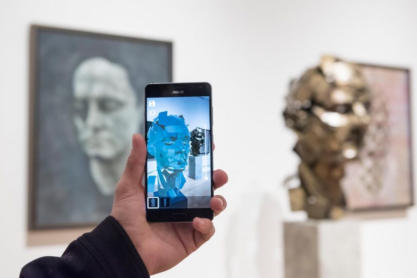 Artist Jonathan Yeo presents his work "Homage to Paolozzi", 2017, created using Google's Tilt Brush virtual reality software (shown on his mobile phone) at the preview of "From Life", a special exhibition at the Royal Academy examining what making art from life has meant to artists throughout history and how the practice has evolved as technology opens up new ways of creating artworks.